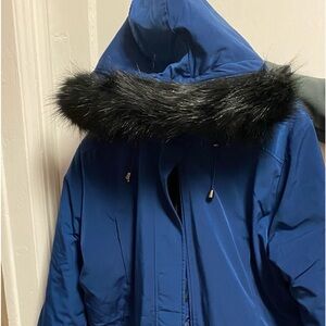 Women’s winter coat. Size 1x.Dark blue four pockets 2 zipper and 2 side. Quilted